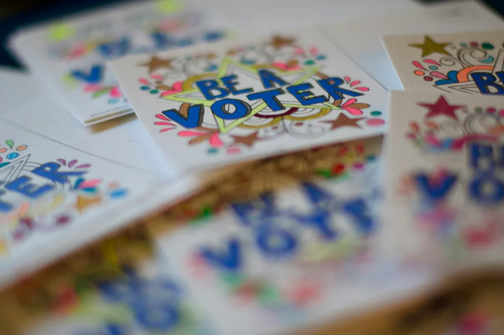 Hand drawn colorful cards showing the text "Be a Voter".